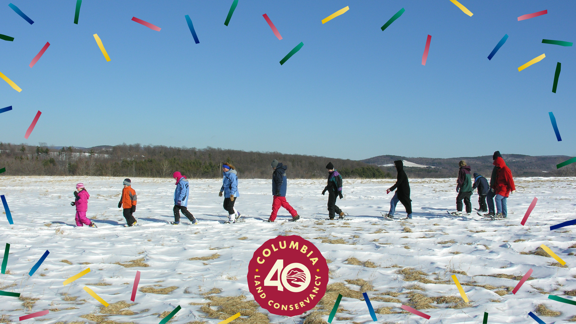 group of people snowshoeing used for promo of first day hike